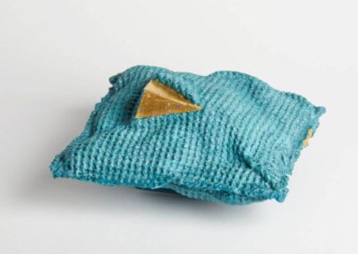 Blue textured glass and gold sculpture