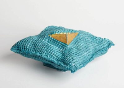 Blue textured glass and gold sculpture