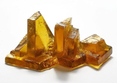 Alternative view or amber rocky outcrop with golde lichen