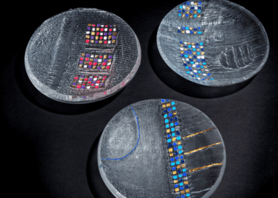 Three Handmade art glass bowl with blue or pink squares and gold decoration on a black backdrop made by International glass maker Deborah Timperley