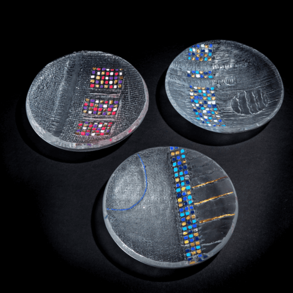 Three Handmade art glass bowl with blue or pink squares and gold decoration on a black backdrop made by International glass maker Deborah Timperley