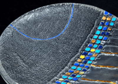 Close up of handmade Art glass bowl with blue and gold decoration made by International glass maker Deborah Timperley