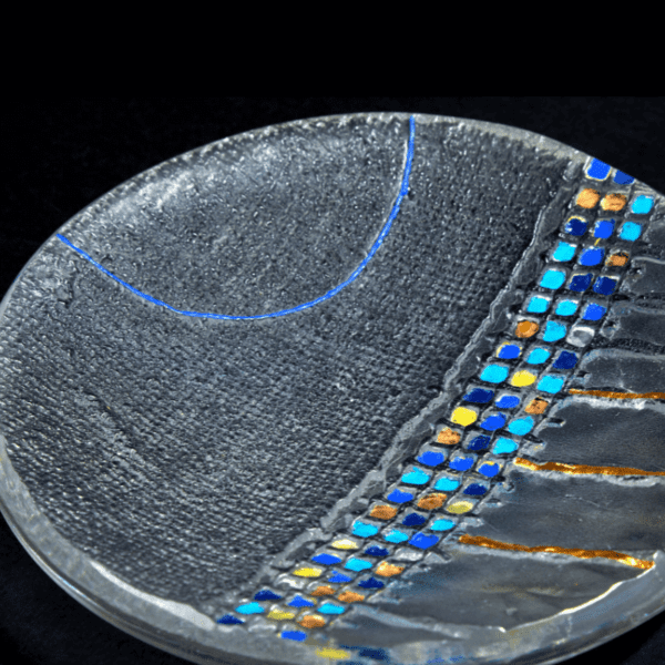 Close up of handmade Art glass bowl with blue and gold decoration made by International glass maker Deborah Timperley