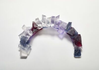 Top view of handmade glass sculpture of a harbour breakwater