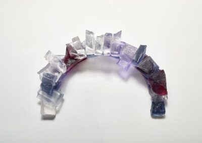 Top view of handmade glass sculpture of a harbour breakwater