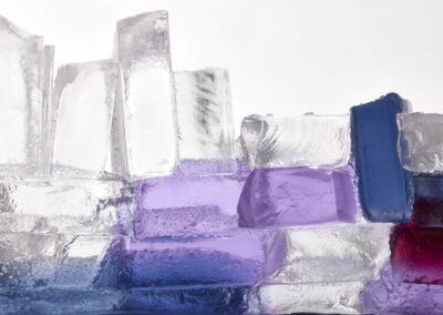 Glass sculpture with purple and blue hues, close-up.