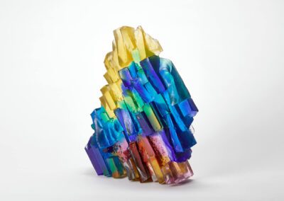 Handmade Art Glass Sculpture inspired by sunshine through water lighting up the rocks below by International Glass Maker Deborah Timperley