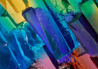 Handmade Art Glass Sculpture inspired by sunshine through water lighting up the rocks below by International Glass Maker Deborah Timperley