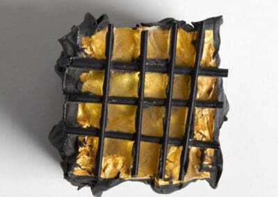 Gold leaf on a glass sculpture project, highlighting luxury and artistic detail.