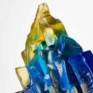 Colourful glass sculpture with yellow, green, and blue tones, abstract art piece by Deborah Timperle.