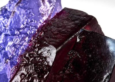 Rocky outcrop surrounded by purple heathers. Landscape glass sculpture by Deborah Timperley.