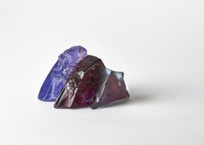 Rocky outcrop surrounded by purple heathers. Landscape glass sculpture by Deborah Timperley.