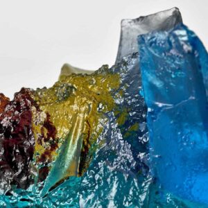Rocky outcrop in blue, yellow and amber. Landscape glass sculpture by Deborah Timperley.